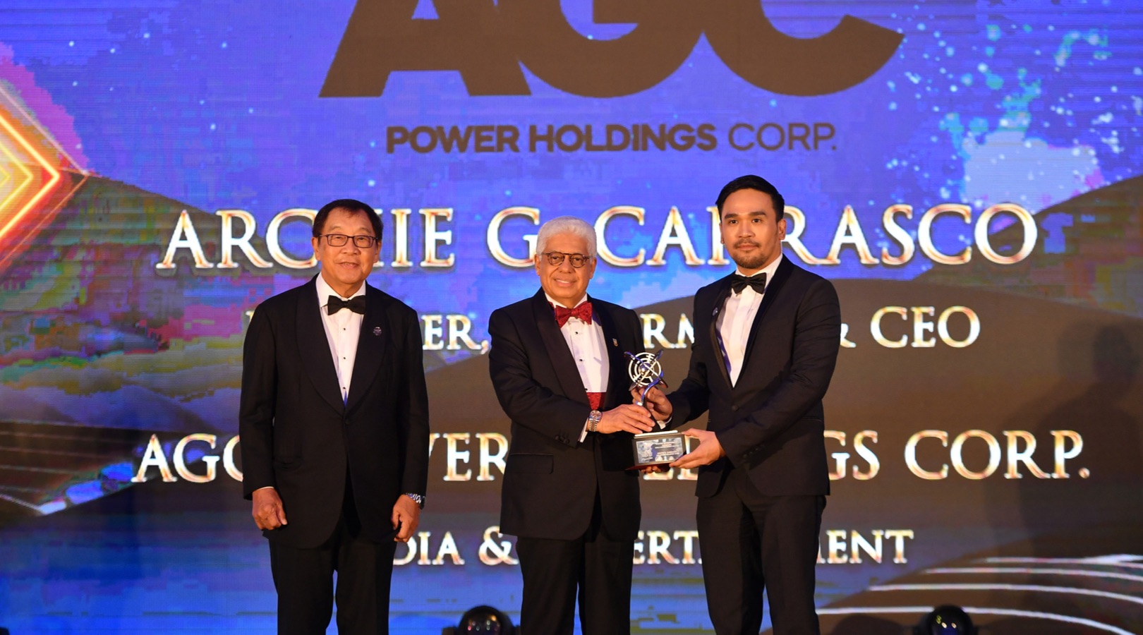 Archie Carrsca receives the trophy at the Asia Pacific Enterprise Awards 2022.