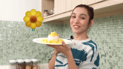 Kyline showing her sunflower inspired scrambled egg creation