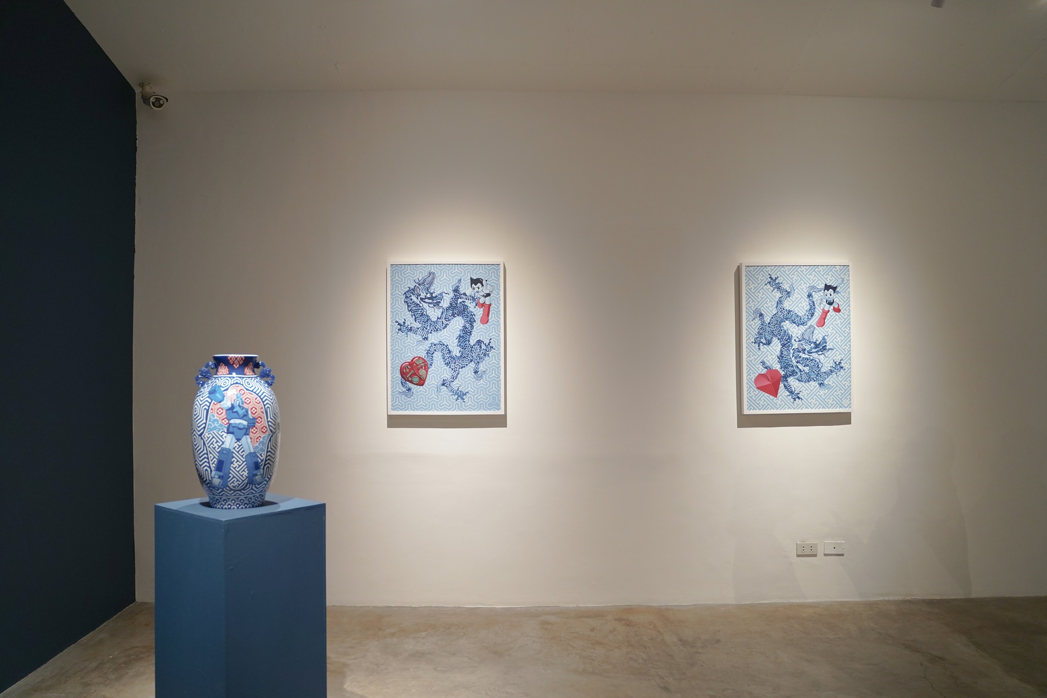 A vase and two paintings by Carlo Tanseco