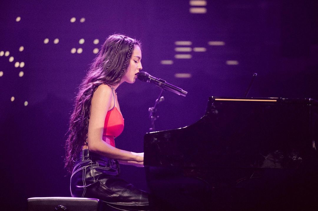 Olivia Rodrigo performing on piano